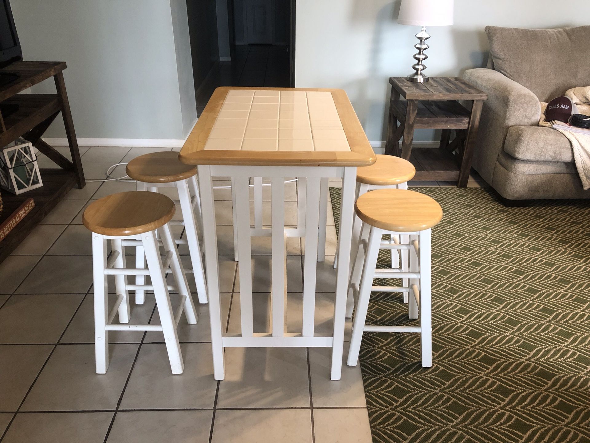 Bar height table with four stools