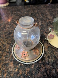 Hummingbird bird feeders and a seed feeder