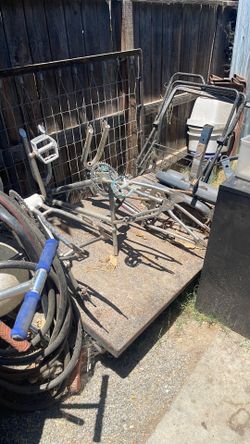 two iron push carts with wheels