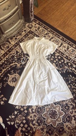 White button down dress with ties in the middle