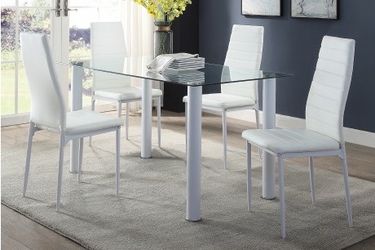 Brand new white dining set. Table and 4 chairs