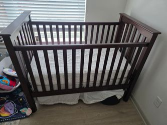 Pottery Barn Kids' crib / convertible toddler bed | Dark wood | Standard crib size