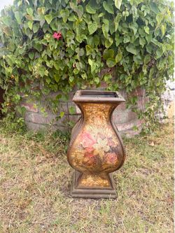 Distressed floral decorative urn