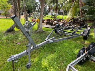 Galvanized heavy duty dual Axel trailer up to 25’ boat or 7,000lb. New 15’ wheels, new winch stand, new winch. No work needed. Ready to load…
