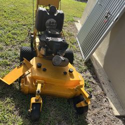 Wright 36 inch walk behind. Lawnmower works great never used commercially one homeowner use only.