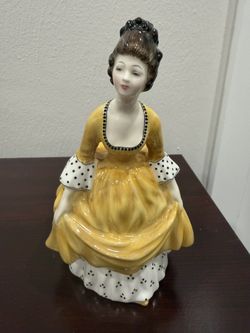 Royal Doulton bone china figurine named "Coralie" (HN 2307).  