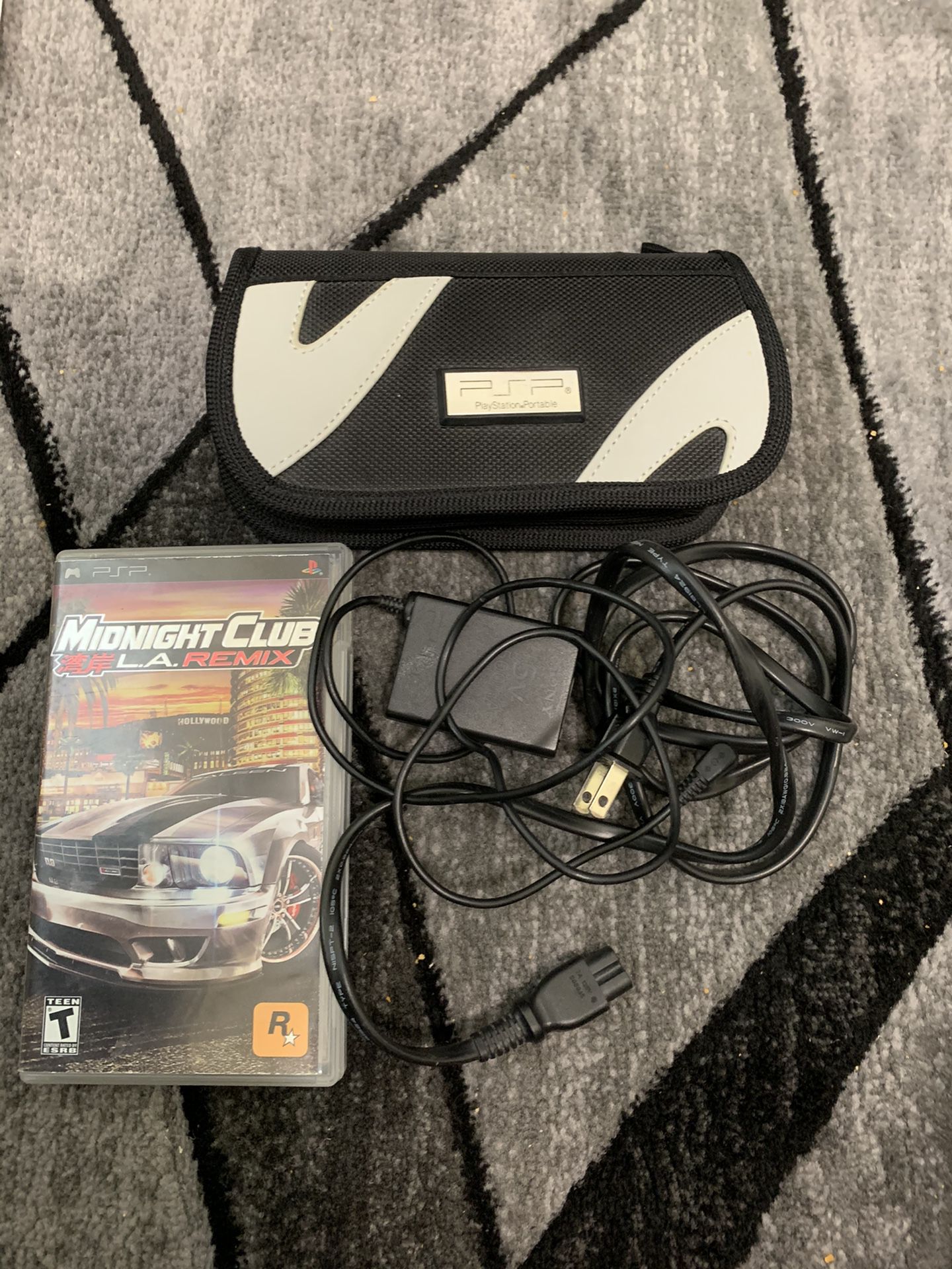 PSP carrying case, charger, and midnight club videogame