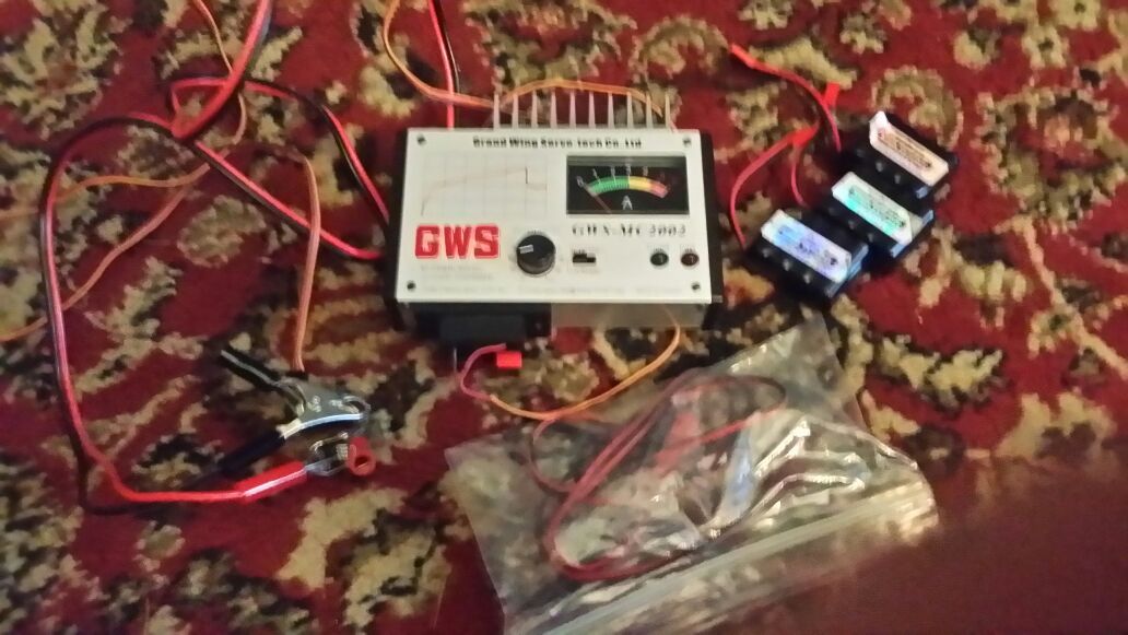 Gws- mc2002 R/C charger with some batteries