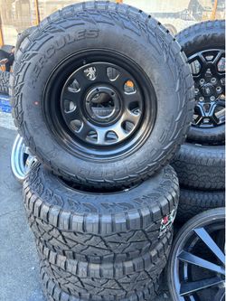17” USED STEEL WHEELS AND RT NEW TIRES 265/70/17