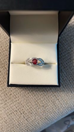 Sterling silver garnet ring with accents