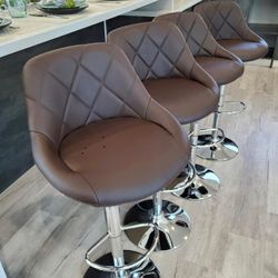 Modern design adjustable bar stools/ barstools in box only  $75 each. 