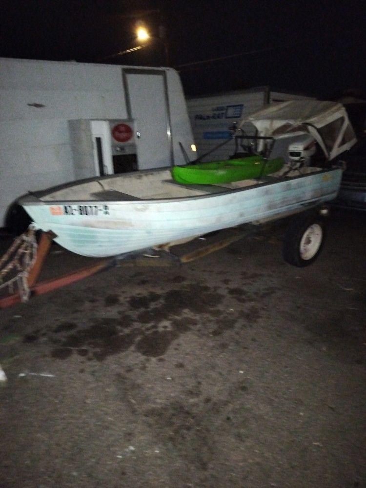 Fishing Boat With A 7½ HP. Johnson Outboard Motor And Trailer