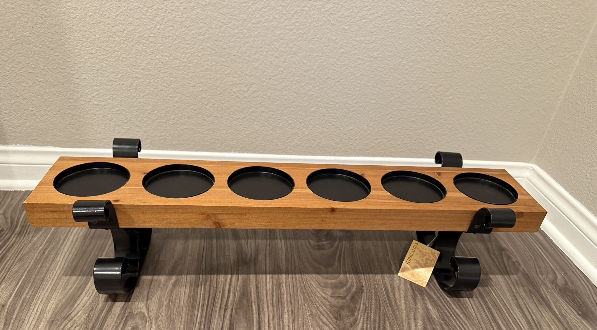 Wood candle holder with metal scroll