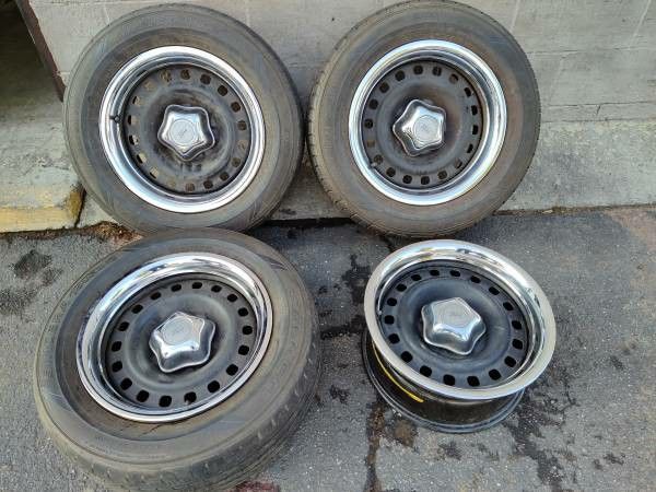 original steel Ford 16 inch rims with caps and trim rings. 5 on 4.5