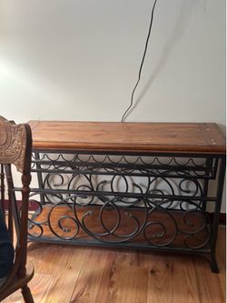 Solid wood console table with wine bottle holder