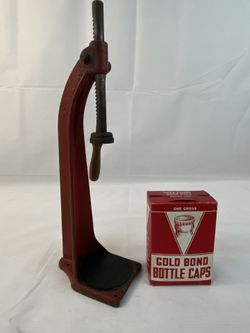 Vintage bottle capper red with a few Gold Bond caps
