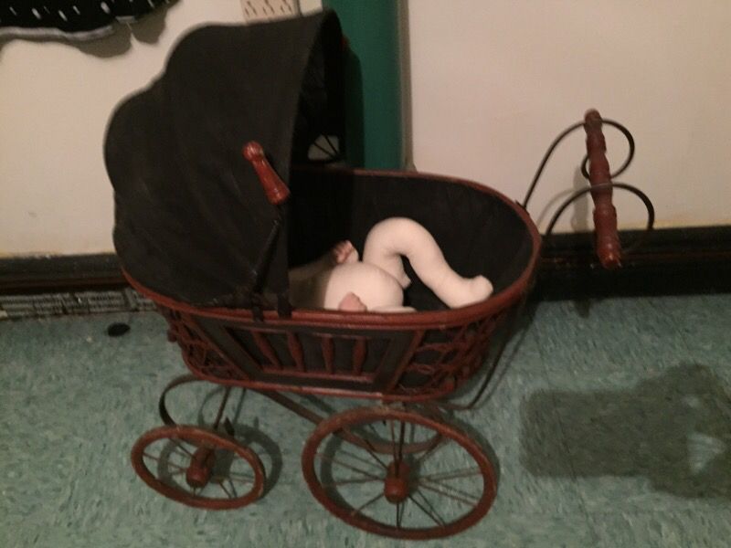 Antique doll carriage and doll