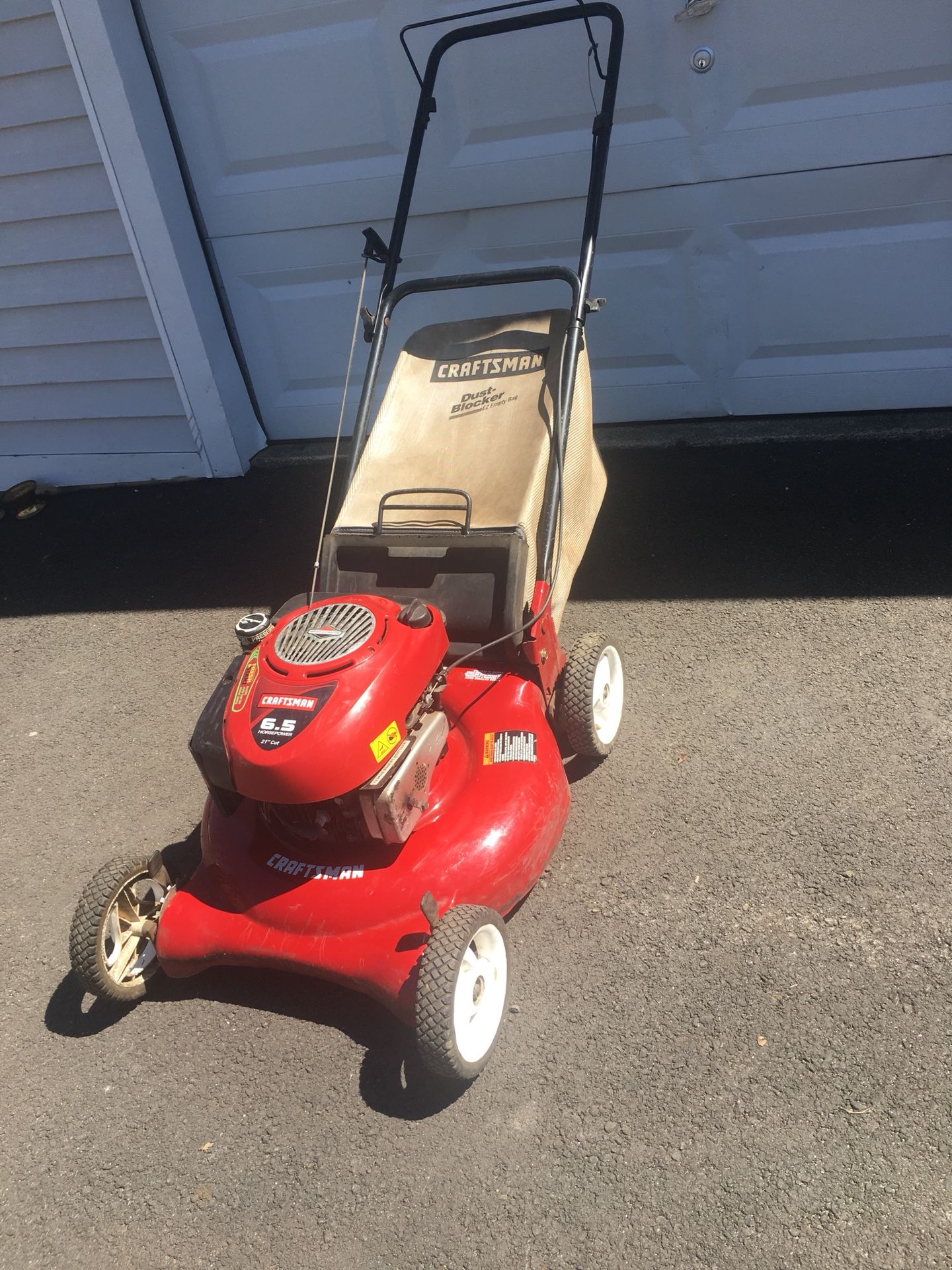 Red and black craftsman lawn mower