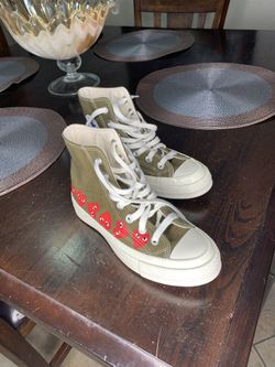 Olive green Converse high tops with red heart design. Comme des Garcons men’s 3 women’s 5 $50