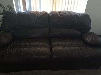 Black sofa and grey recliner