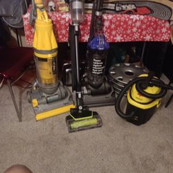 Dyson's Vacuum Upright Vacuum Cleaner And A Stanley Tub Cleaner