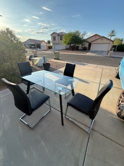 Glass table with set of chairs