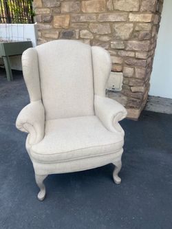 Wingback Armchair and Black Barrel Chair