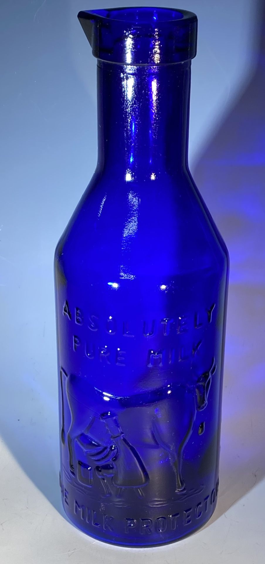 "Cobalt Blue Glass Milk Bottle "Absolutely Pure Milk The Milk Protector” Embossed