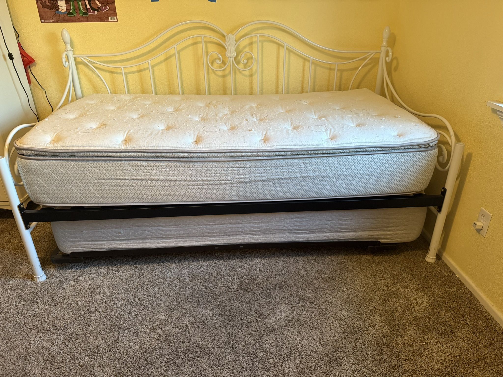 White Rod Iron Twin Bed With A Trundle bed Underneath