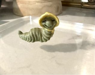 Miniature Retired Hagen Renaker Caterpillar Mama With Yellow Bonnet  She’s an oldie !  Has a few chips under her bonnet - see pics   Sure to bring cha
