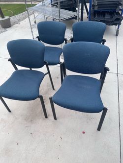 4 blue fabric chairs
