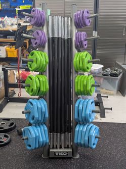 TKO barbell (9), weight plates (315 lbs) & Rack cardio pump set