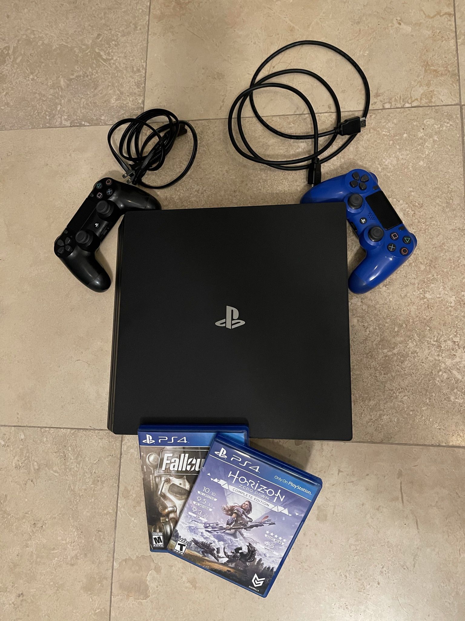 PS4 Pro w/ 2 controllers and 2 games