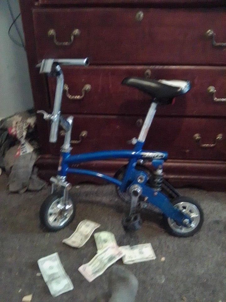 A Clock Ring And A Mini Stunt Bike