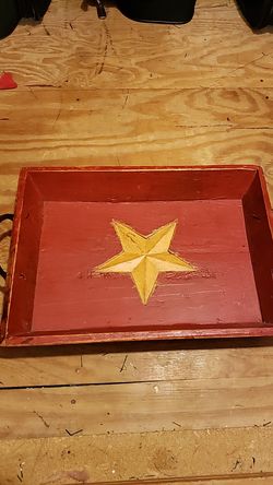 Red tray with star. Antique wooden