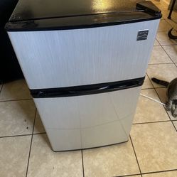 Refrigerator 33 Inches high. 20 Inches Wide 20 1/2 Crossed 