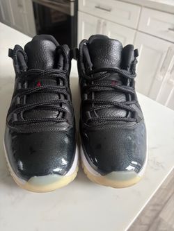 Air Jordan 11 Retro Black Patent Sneakers