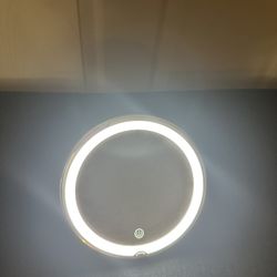 Round LED magnifying vanity mirror