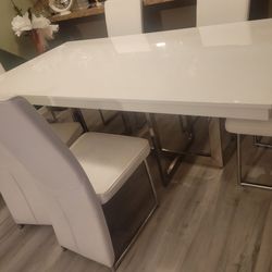All White table with 6 all white leather chairs