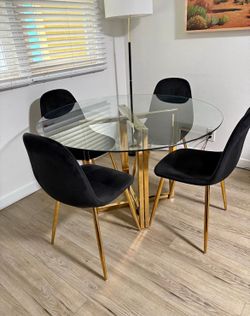 Round table dining set with velvet chairs