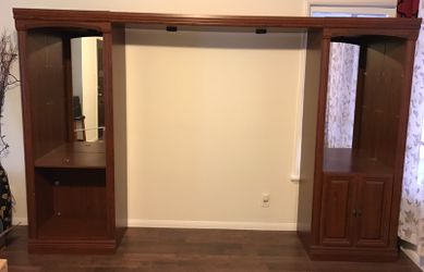 Entertainment center-cherry finish it has 4 glass shelves and 2 wooden shelf