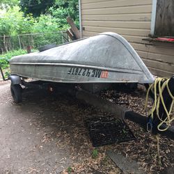 12' Montgomery ward row boat with motor