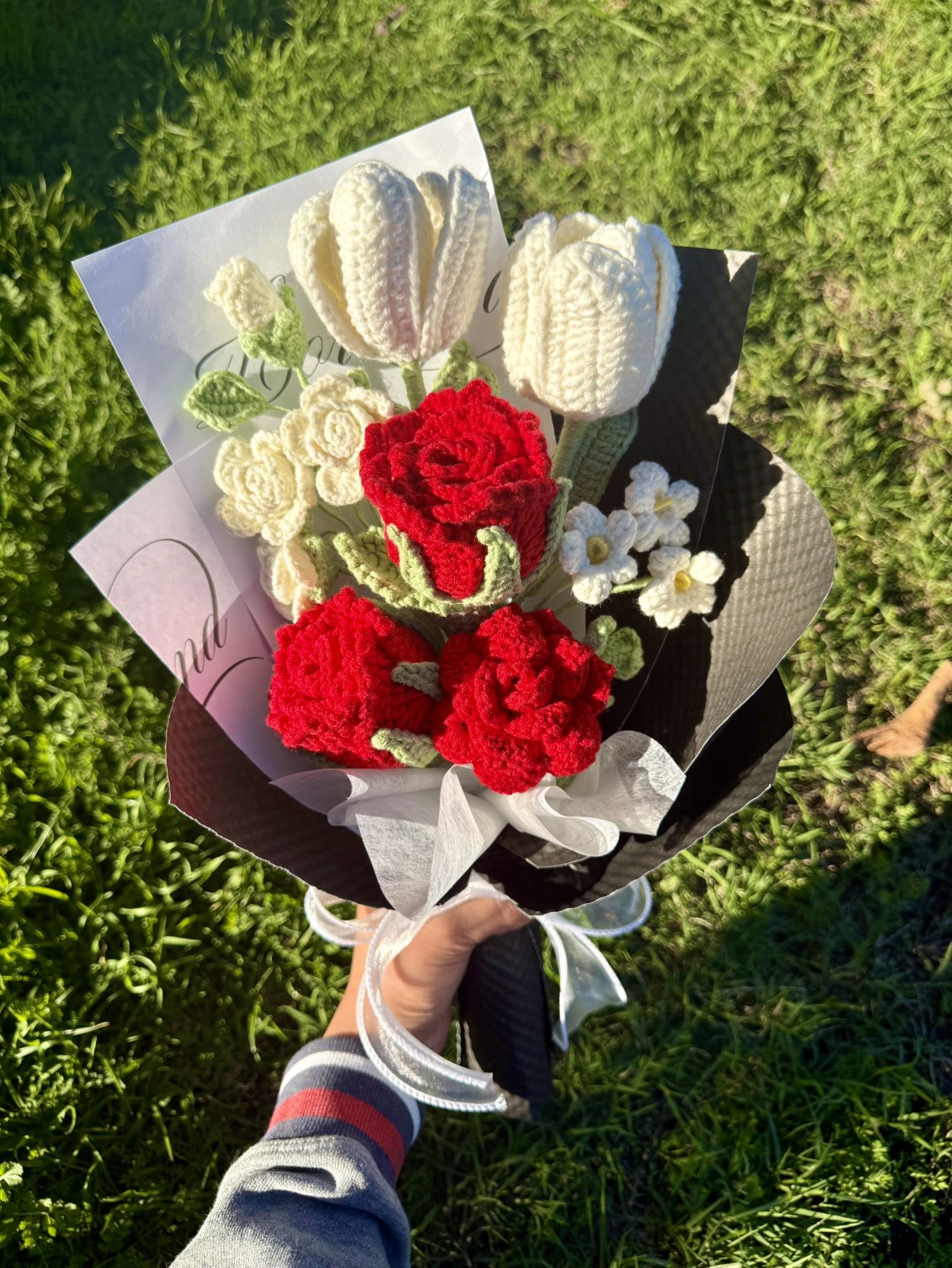 Crocheted red roses and white tulips bouquet