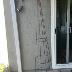 Tall Metal Tower That Holds Plants To Grow On 