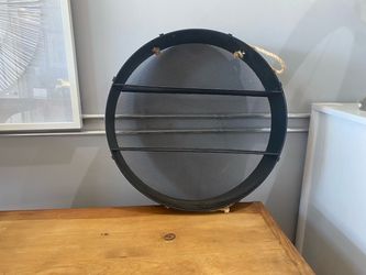 Small modern metal round wall hanging shelf with rope details