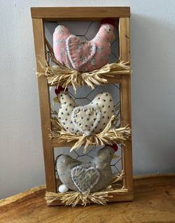 country farmhouse chicken decor features fabric hens nestled in a wooden ladder frame