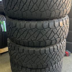 Used tires 285/65/18 nitto all terrain mount & balance recycling included $450