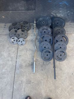 Standard weights 210lbs total plus 4ft bar and curl bar