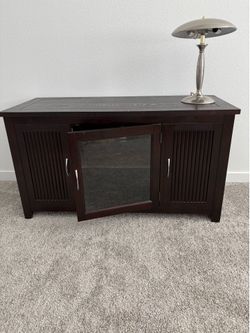 Dark brown/Black TV console with glass do