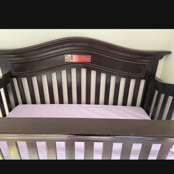 Baby crib with mattress (costs more than $500)